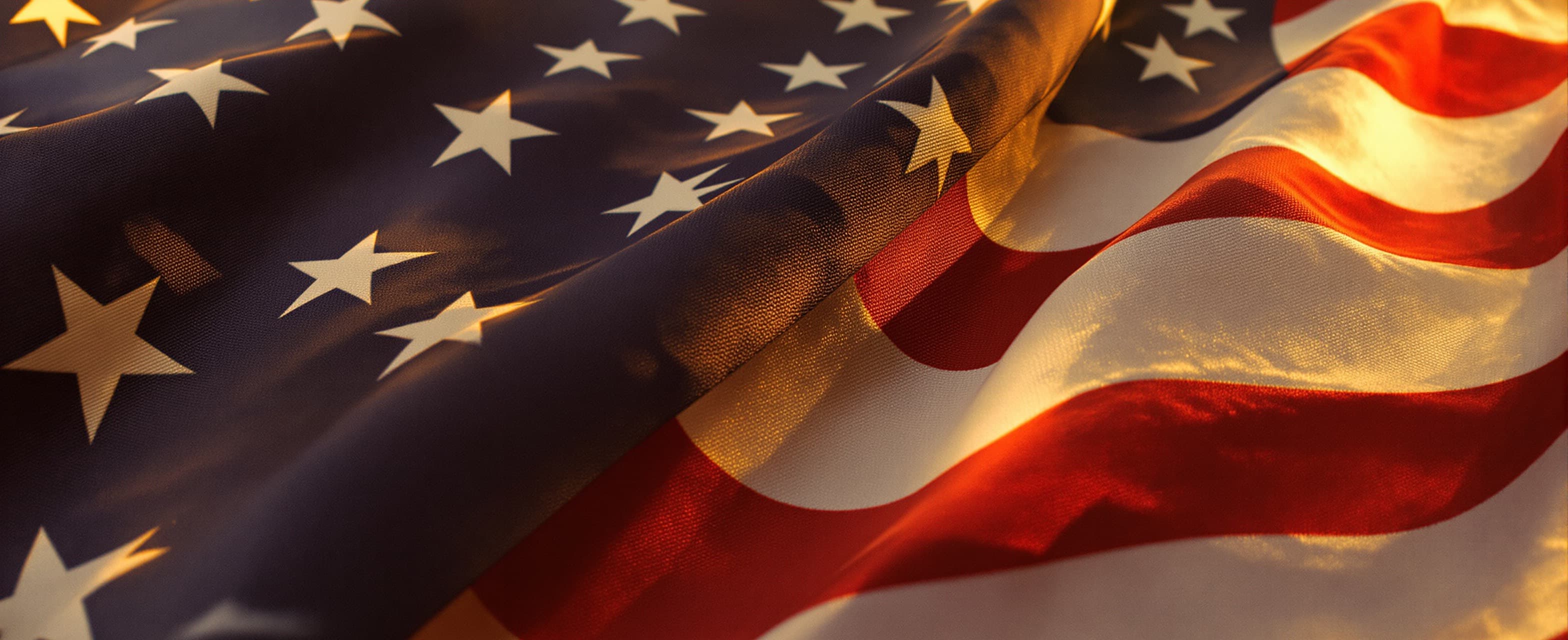 American flag fabric rippling in golden-hour light